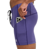 Purple athletic shorts with a pocket holding a phone on a white background